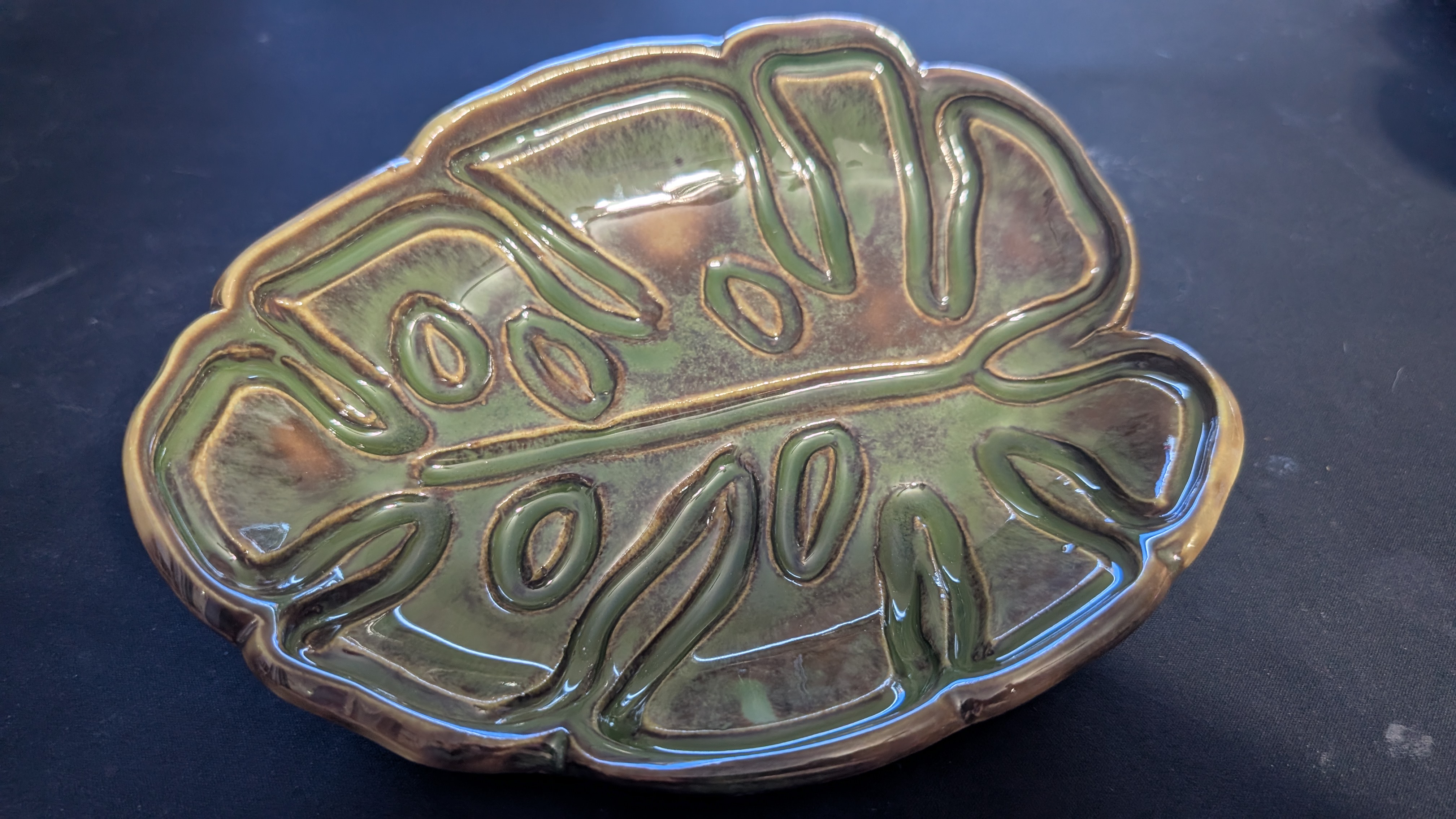 Leaf ceramic example refined with hand-building tools after stamping